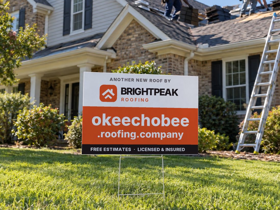 okeechobee.roofing.company on a yard sign in front of a house getting a new roof